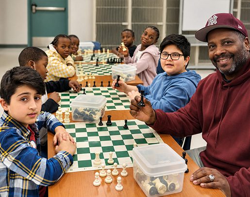 Group of kids sitting in chess program
