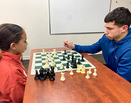 Two kids playing chess