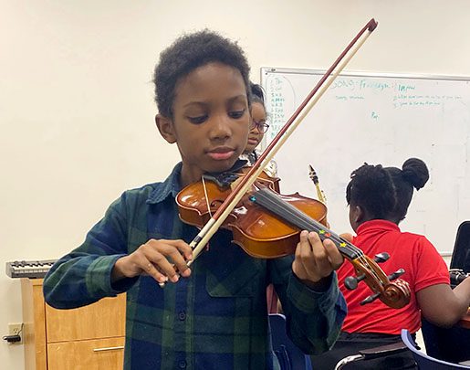 Young boy playing violin
